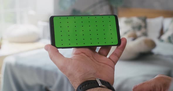 Man Using a Smartphone alt