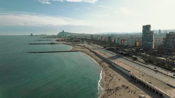 The skyline of Barcelona with the sea, the beach and modern buildings