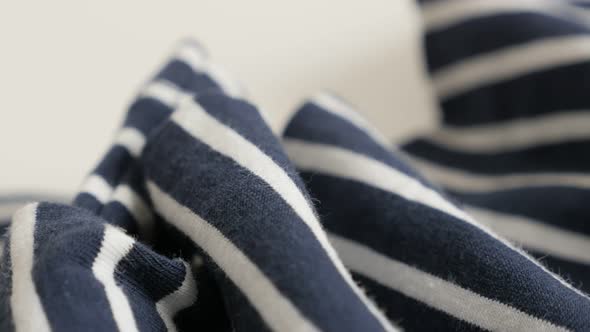 Blue and white striped fabric sample close-up 4K 2160p 30fps UltraHD footage - Gathers of sailor mar alt