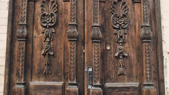 An Old Wooden Door in To a Beautiful Ancient Place Tilt-up Shot. Wood Texture Doors alt