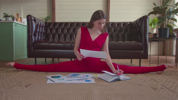 Freelance Woman Sitting on Twine Analyzing Charts alt