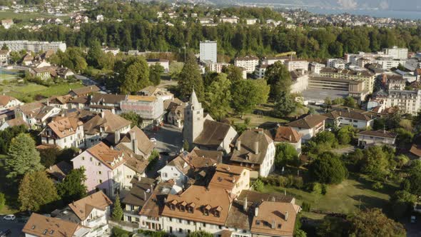 Aerial orbit around church. Corsier-sur-Vevey, Vaud - Switzerland alt