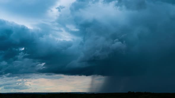 Timelapse Gray Rainy Clouds Float Across the Dark Sky on a Cloudy Day alt