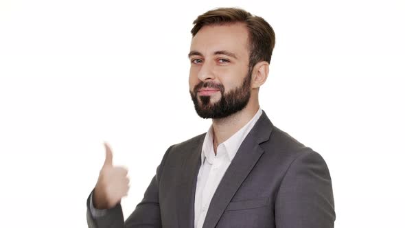 Halfturned Portrait of Male Employer Wearing Beard and Mustaches Posing on Camera Showing Thumb Up alt