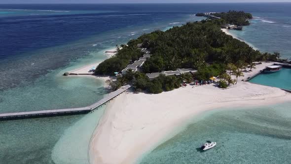 Aerial View of a Tropical Paradise Island Bay Covered in Limestone Trees with Crystal Clear Beach