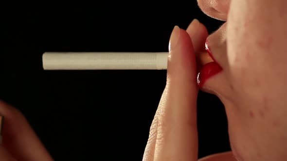 Woman cigarette close up mouth studio
