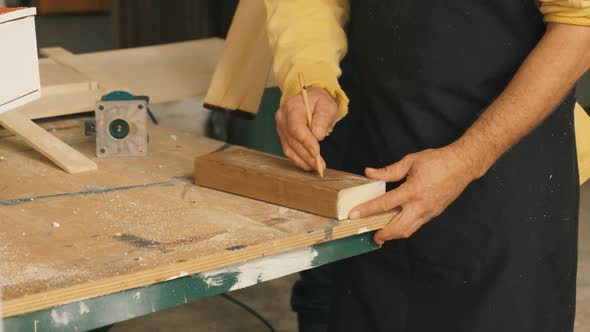 Man Working on a Drilling Machine