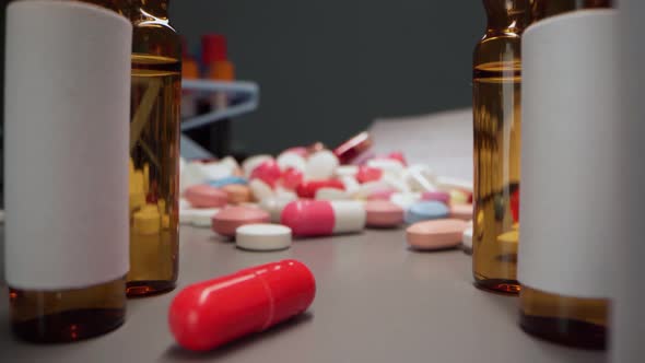 Zoom in Video of Medication Pills and Vials on Table Close Up