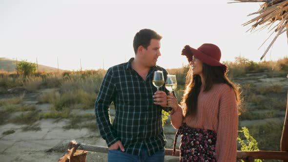Couple Tasting Wine on a Pontoon in Warm Sunligh alt