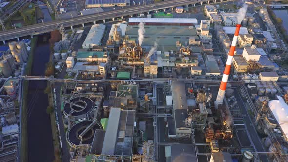 Aerial view of petrochemical oil refinery and sea in industrial engineering alt
