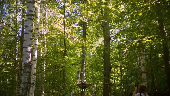 Girl Goes Down a Rope on a Hook alt