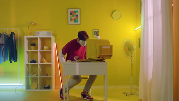 Young Man Hacker In Yellow Office
