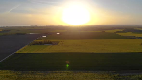 Drone flying towards horizon and upwards. Lonely windmill spinning prt-two alt