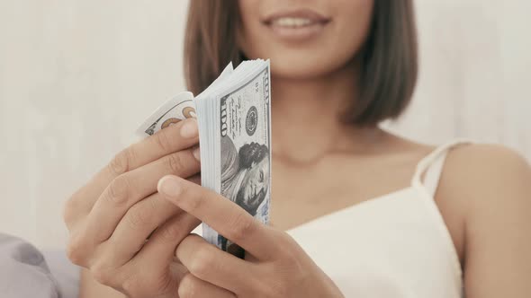 Portrait of young beautiful brunette model posing in white interior alt