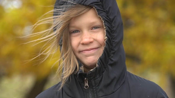 Closeup portrait of happy adorable child girl smiling. Slow motion.