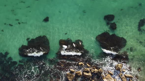 Aerial Panoramic View of Seascape with Crystal Clear Azure Sea and Rocky Shores alt