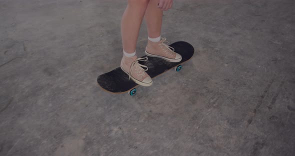 Fashionable young woman in an abandoned warehouse alt