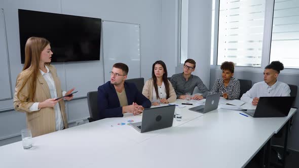 Businesswoman Giving Presentation in Meeting Room alt