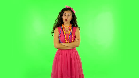 Girl Listens Carefully, Threatens with a Finger and Waves Her Head. Green Screen alt