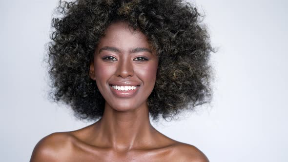 Smiling Black Woman with Curly Hair