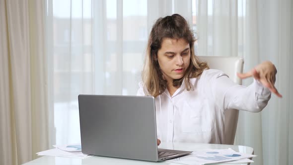 Disabled Woman Freelancer Works on Laptop From Home at Table alt