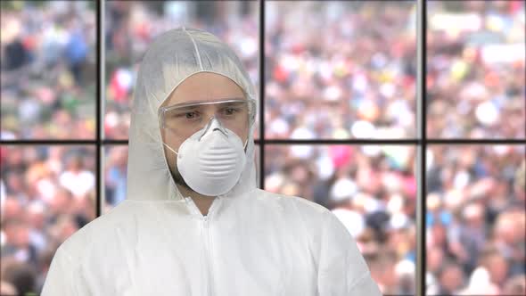 Portrait of a Guy Wearing White Respiratory Mask and Protective Suit alt