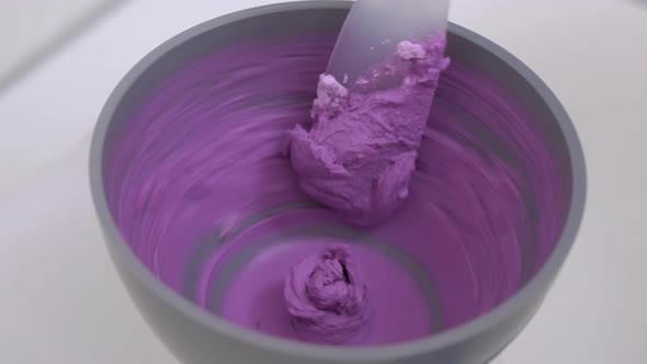 Alginate Impression Orthodontist Prepares Mixture to Measure Mouth alt