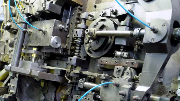 Metal Aluminum Copper Wire Tips Fall Into the Basket of the Manufacturing Machine alt