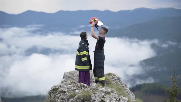 Happy Firefighter with his Wife in the Mountains