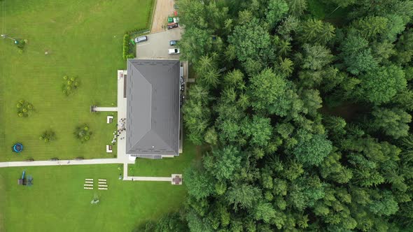 Top View of the Wedding Venue in a Green Field and a House in the Forest. Wedding Ceremony with alt