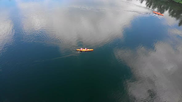 Drone Aerial Shot of People Swimming on Kayak on River