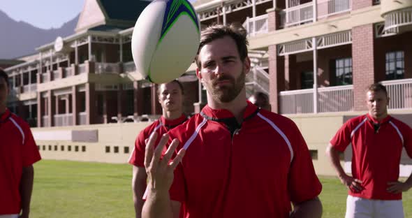 Male rugby players standing with rugby ball in the rugby ground 4k