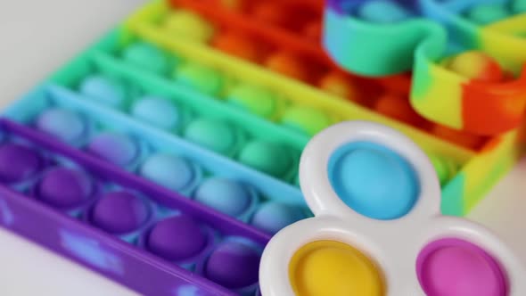 Anti-stress toys pop it, simple dimple, snapperz spinning on white background. alt