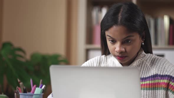 Young Black Female University Student Studying on Computer at Home alt