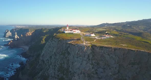 aerial shot around of Cliffs at Cabo da Roca (Cape Roca) in Portugal that forms the westernmost main alt