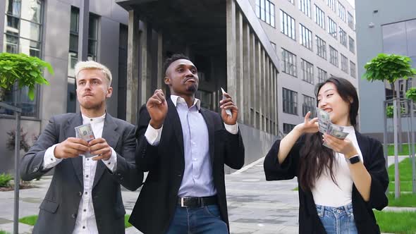 Multiracial Group of Two Men and One Woman which Having Fun Together Outdoors alt