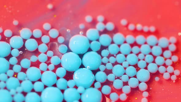 Bright Collors Bubbles Slow Motion Oil Ink. Pink and blue Bubblegum flavor background. alt