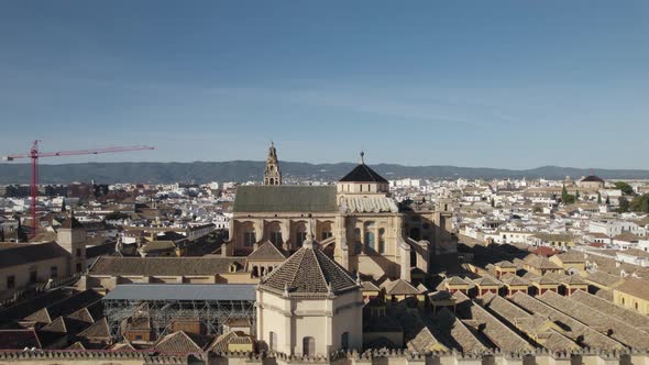 Stunning aerial drone pov flying toward Mezquita Cathedral of Cordoba in Spain