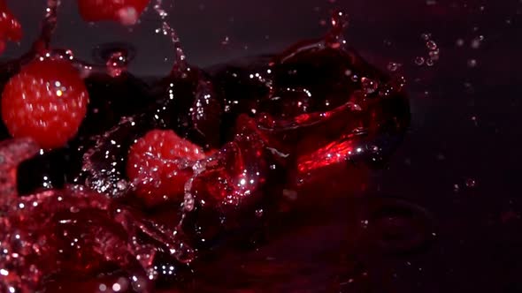 Ripe Red Raspberries Fall Into Juice alt