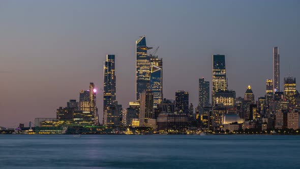 Day to Night Timelapse Sunset Clouds Moving Over Hudson Yards POV view from Hudson River