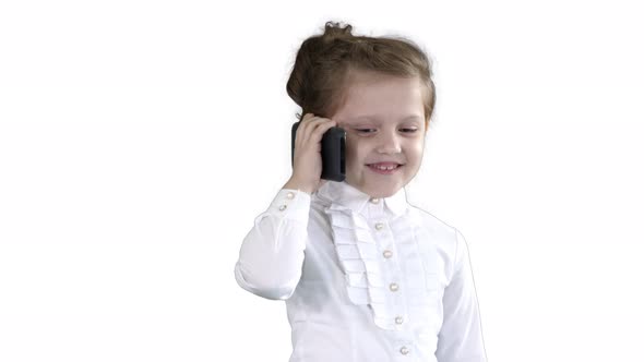 Beautiful Little Girl, Talking on the Phone on White Background alt
