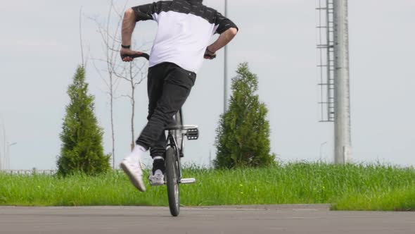BMX Flatland Bicycle Rider Performing a Trick Pedaling Time Machine No Hand alt