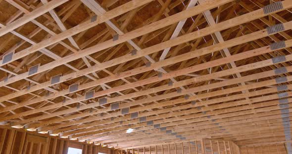 On the Construction of Wooden Building an Interior View of Wood Beams Framework Under Construction alt