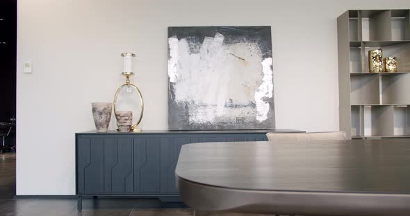 Shelves with home stuff. Indoor minimalist furniture.Modern painting in interior alt