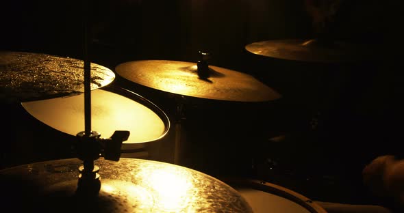 Drummer playing drum in studio alt