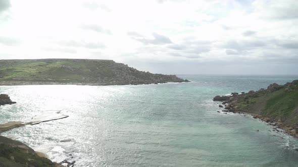 Panoramic View of Il-Qarraba Rock and Qarraba Bay on Cloudy Windy Day in Malta