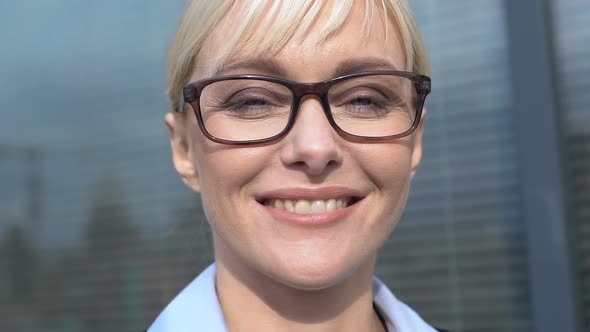 Cheerful Business Lady in Glasses Looking to Camera Feeling Proud and Inspired