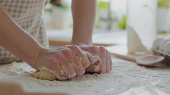 Closeup Female Hands Knead Dough on Table Using Wheat Flour Prepares Bread Baking at Home in Modern alt