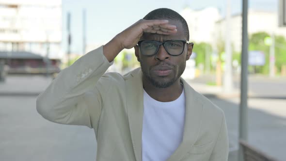 African Man Pointing at the Camera Outdoor alt