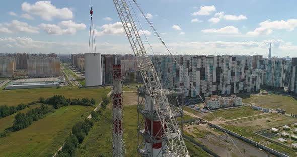 Chimney Pipe Construction, the Crane Lifts the Pipe Segment, Aerial Shot alt